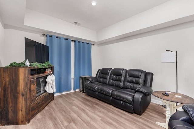 living room with light hardwood / wood-style floors