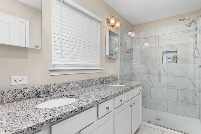 bathroom with vanity and walk in shower