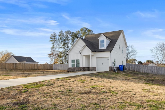 view of front of house with a front yard and a garage