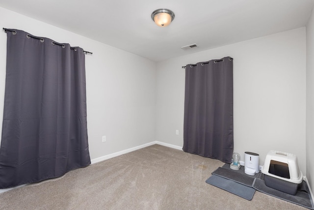 empty room featuring carpet floors