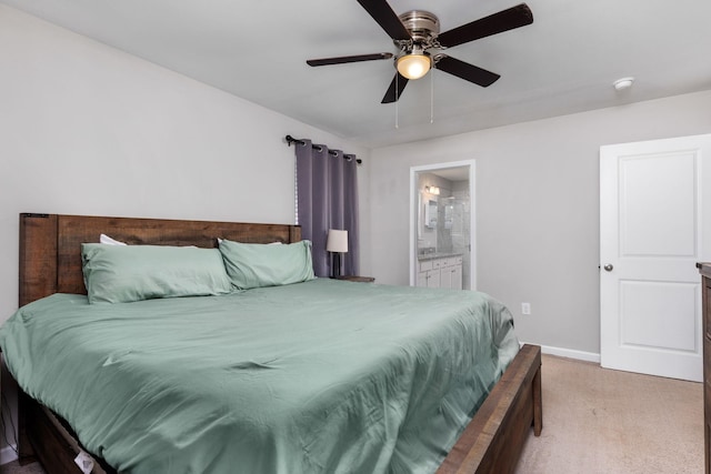 bedroom featuring ensuite bath, ceiling fan, and carpet floors