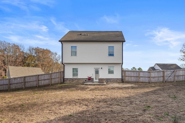 rear view of house with central AC