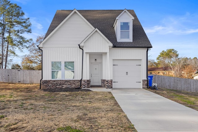 view of front of home with a garage and a front yard