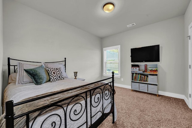  - bedroom featuring baseboards and carpet