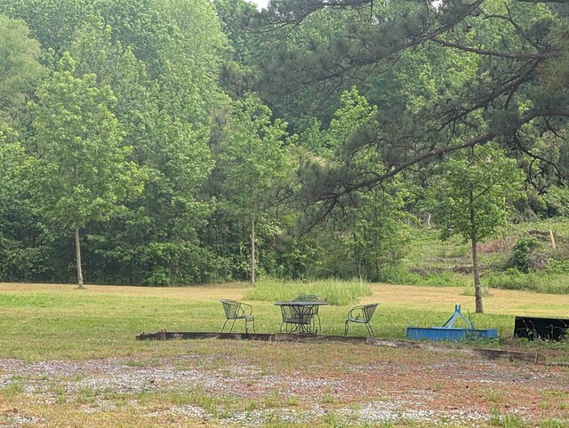 view of yard with a forest view