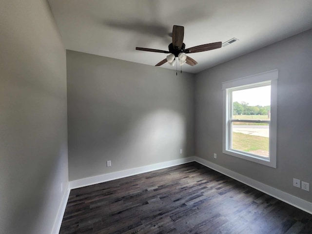 unfurnished room with dark hardwood / wood-style floors and ceiling fan