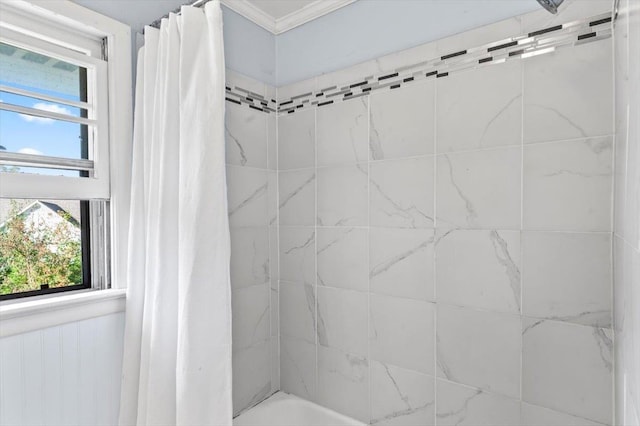 bathroom featuring shower / bath combo with shower curtain and ornamental molding