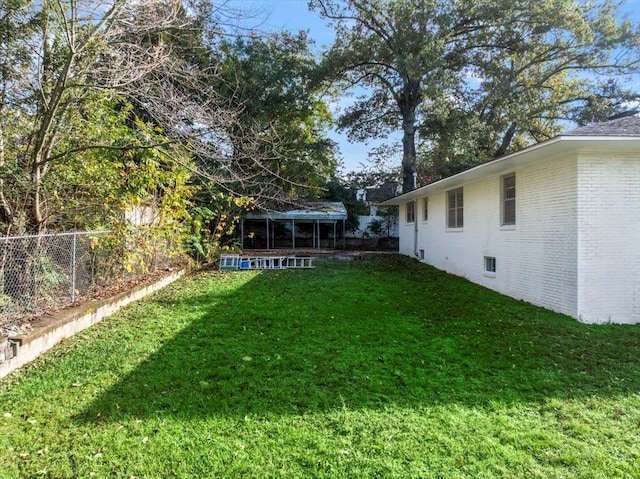 view of yard featuring a sunroom