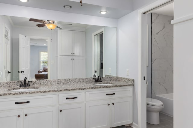 full bathroom with vanity, bathing tub / shower combination, ceiling fan, crown molding, and toilet