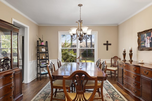 dining room with dark hardwood / wood-style flooring, plenty of natural light, and crown molding