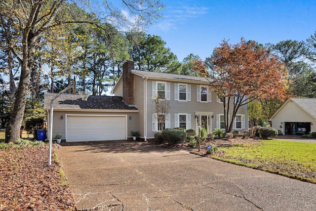 colonial-style house featuring a garage