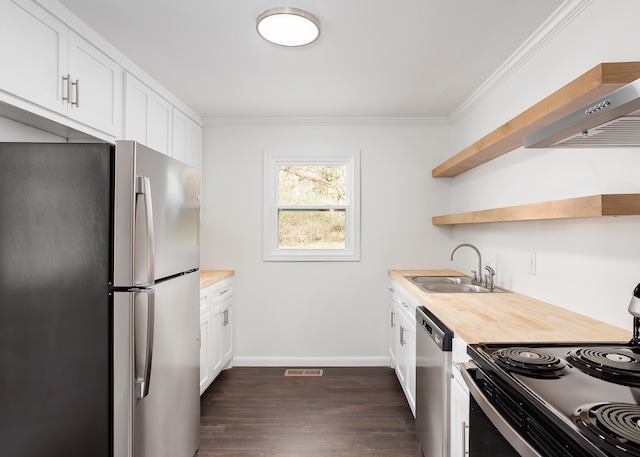 kitchen featuring stainless steel appliances, white cabinetry, sink, and ornamental molding