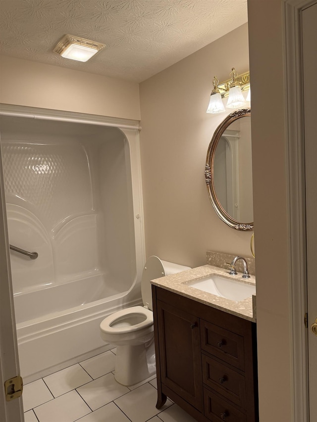 full bathroom featuring vanity,  shower combination, tile patterned floors, toilet, and a textured ceiling