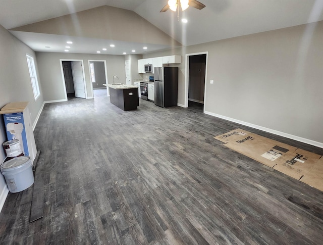 unfurnished living room featuring ceiling fan, high vaulted ceiling, sink, and dark hardwood / wood-style flooring