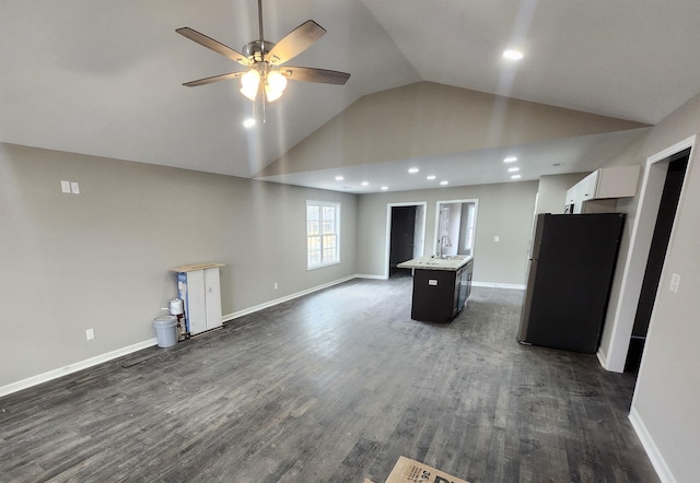 unfurnished living room with ceiling fan, high vaulted ceiling, dark hardwood / wood-style flooring, and sink