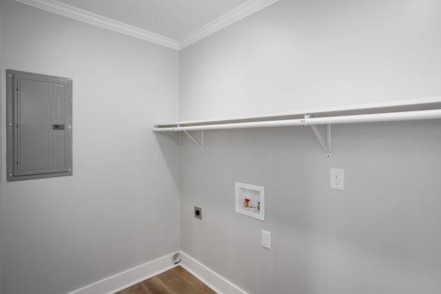 clothes washing area with washer hookup, hookup for an electric dryer, dark hardwood / wood-style flooring, electric panel, and crown molding