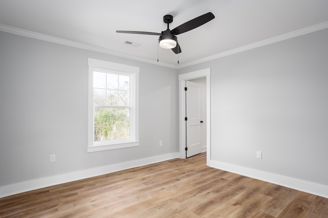 unfurnished room featuring light wood-type flooring, ceiling fan, and ornamental molding