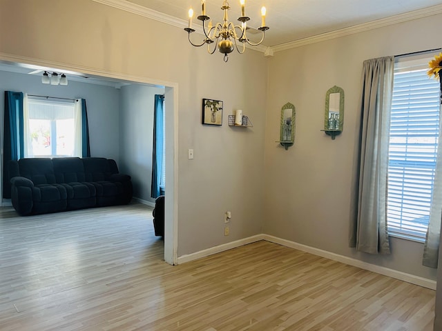 unfurnished room featuring crown molding, light hardwood / wood-style floors, and plenty of natural light