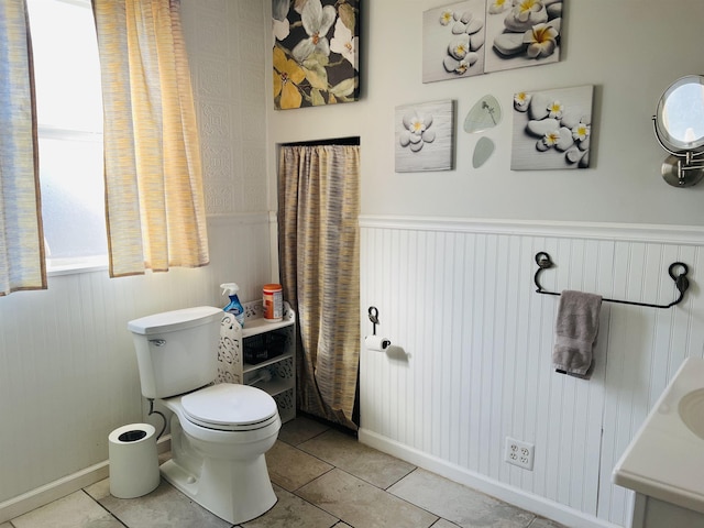 bathroom featuring tile patterned flooring and toilet