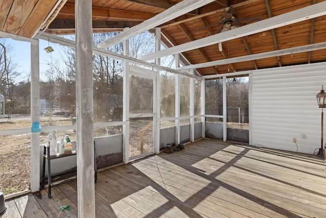 unfurnished sunroom with wood ceiling and vaulted ceiling with beams