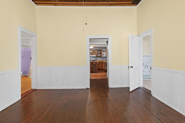 unfurnished room featuring dark hardwood / wood-style floors