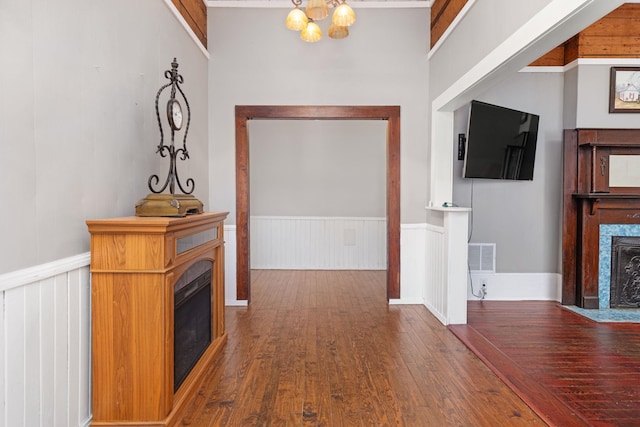 interior space with dark hardwood / wood-style floors and a chandelier