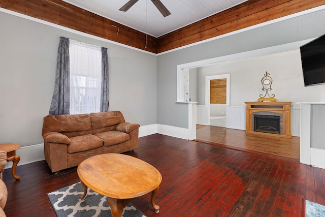 living room featuring hardwood / wood-style floors and ceiling fan