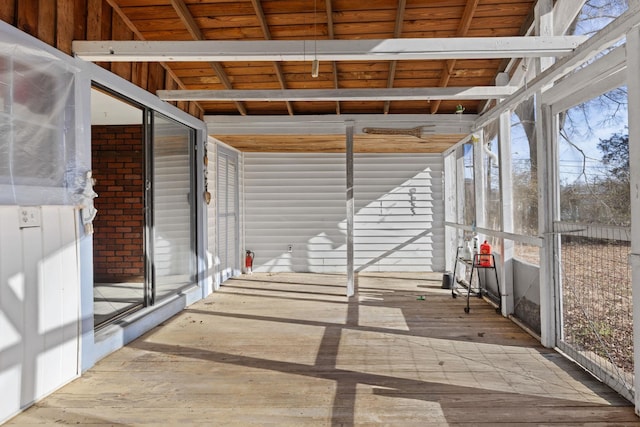 unfurnished sunroom with wooden ceiling