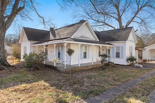 view of front of house with a garage and a porch