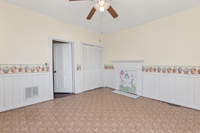 unfurnished bedroom featuring ceiling fan