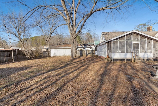 view of yard with a sunroom