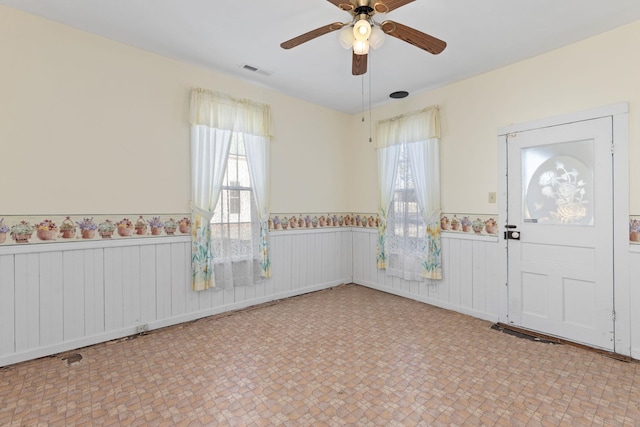 foyer featuring ceiling fan and radiator