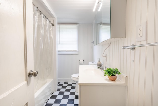  - bathroom featuring tile patterned floors, vanity, toilet, and shower / tub combo