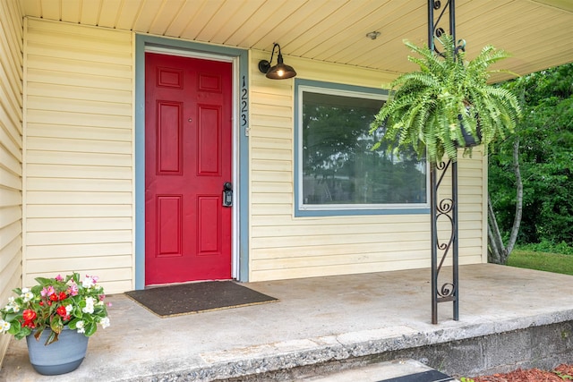  - property entrance featuring a porch
