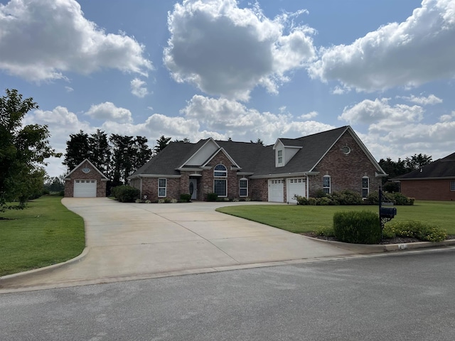 view of front of home with a front lawn and a garage