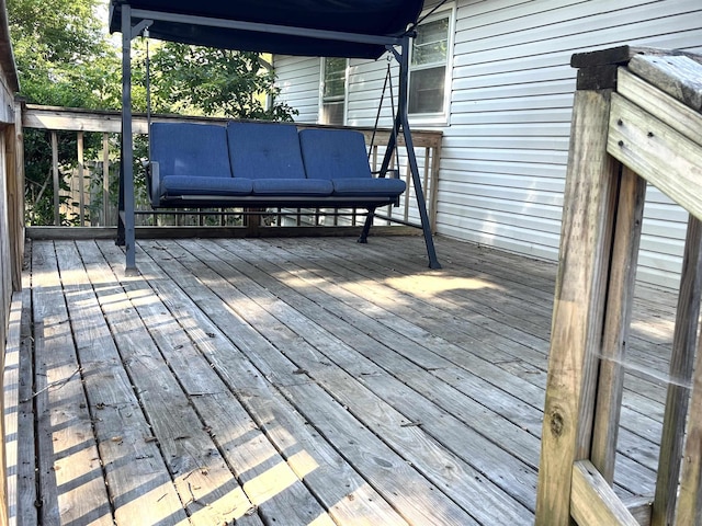 wooden terrace with outdoor lounge area