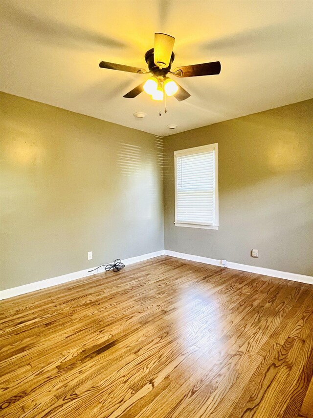 empty room with light hardwood / wood-style flooring and ceiling fan