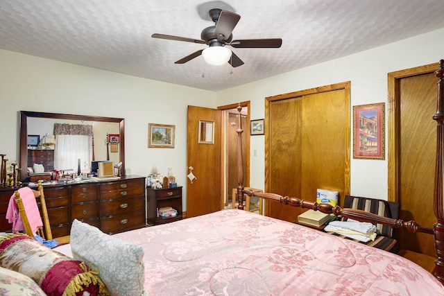 bedroom featuring a textured ceiling and ceiling fan