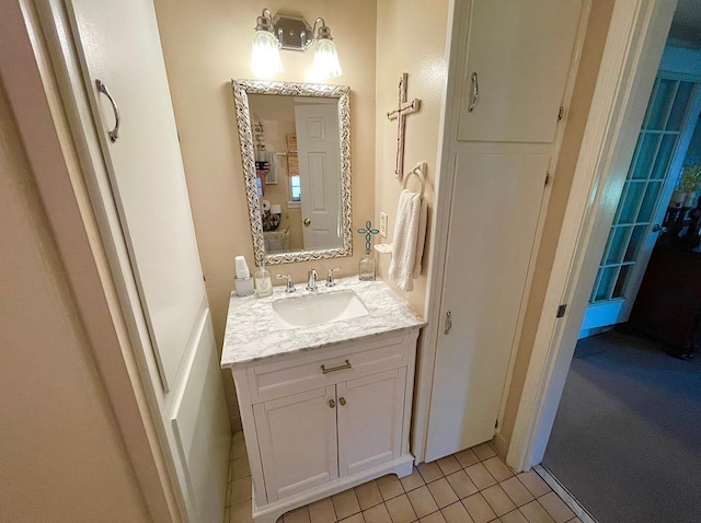 bathroom with tile patterned flooring and vanity