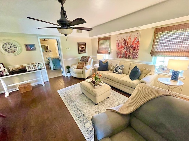 living room featuring ceiling fan and wood-type flooring