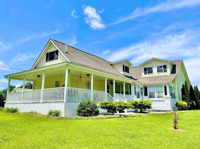 farmhouse with a front yard and a porch