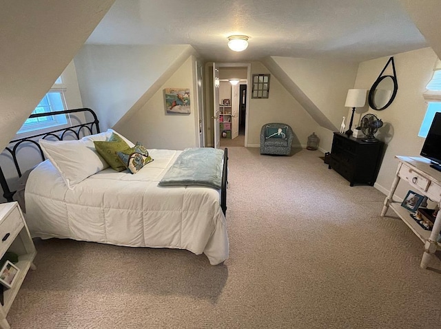 bedroom with carpet and a textured ceiling