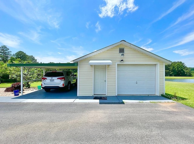 garage featuring a carport