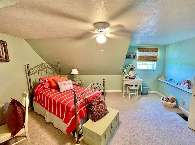 carpeted bedroom featuring ceiling fan, lofted ceiling, and a textured ceiling