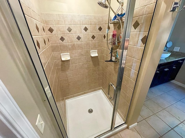 bathroom with tile patterned floors and a shower with shower door