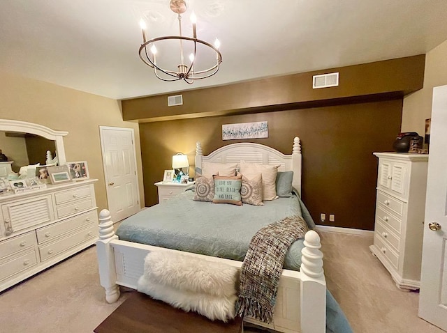 bedroom featuring light carpet and a notable chandelier