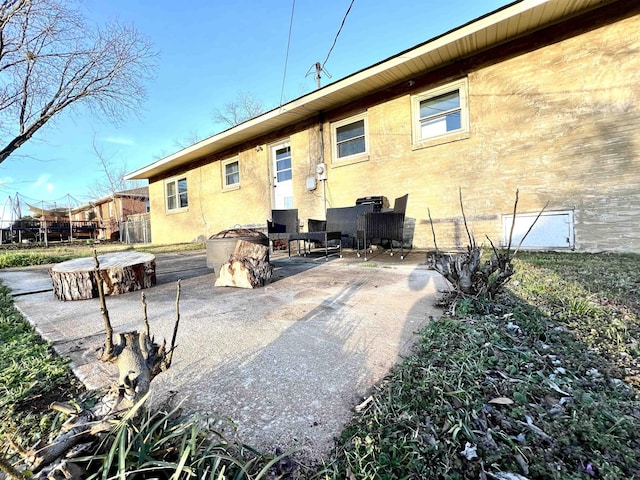 rear view of property featuring a patio area