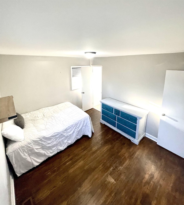 bedroom with wood finished floors