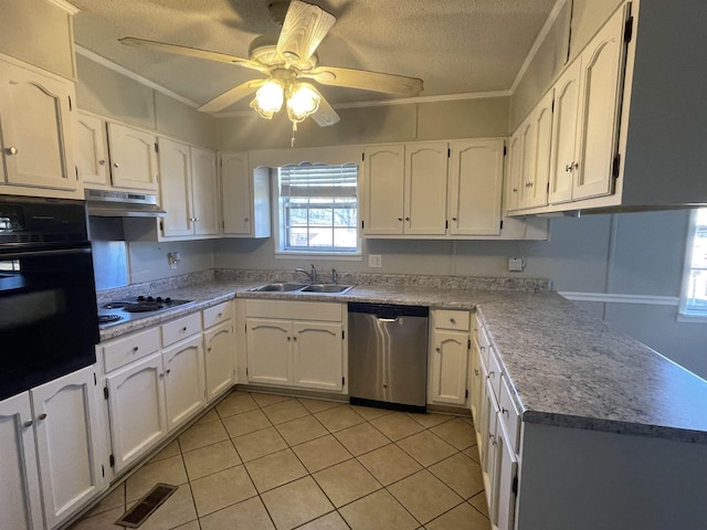 kitchen with white cabinetry, oven, and stainless steel dishwasher