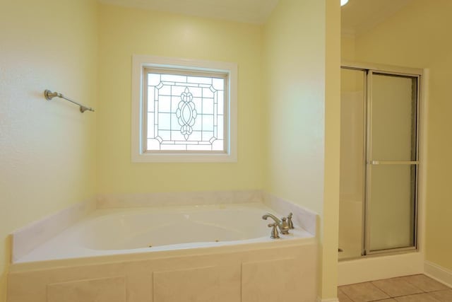 bathroom with tile patterned floors and plus walk in shower